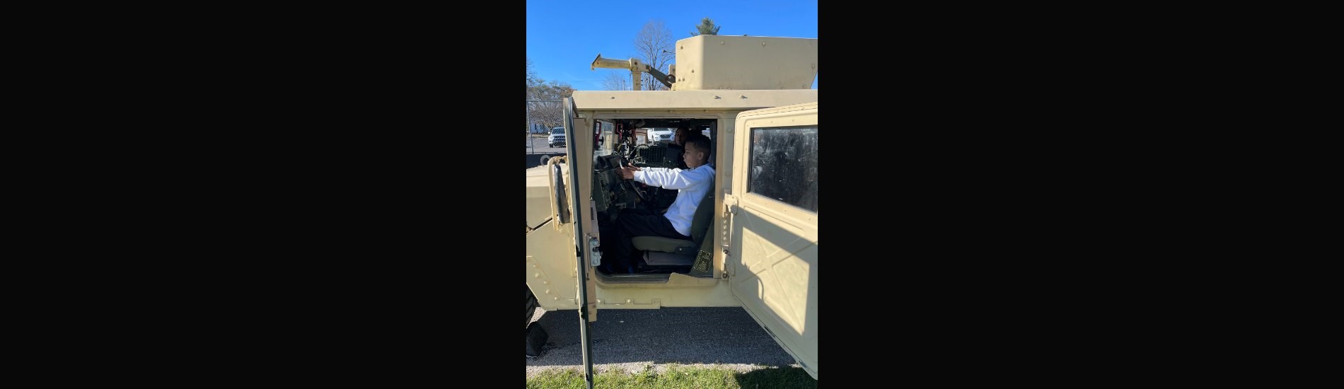 8th grader Ethan T. in the Arsenal humvee