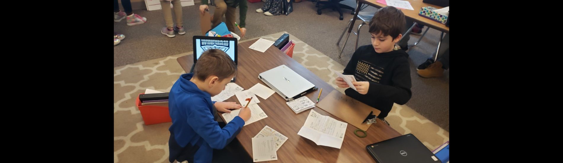 3rd graders working on their letters to pen pals in West Hills, California